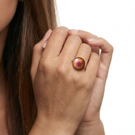 Round gold ring with orange flower